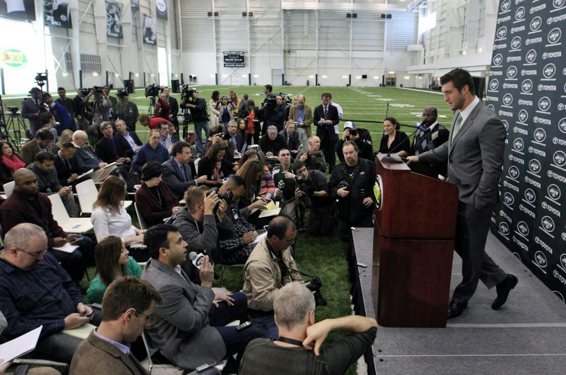 Tim Tebow holds his first news conference with the New York Jets, in Florham Park, N.J., Monday, March 26, 2012. Tebow, who led the Denver Broncos to the playoffs last year, was acquired in a trade Wednesday with Denver and will serve as the backup quarterback to Mark Sanchez.