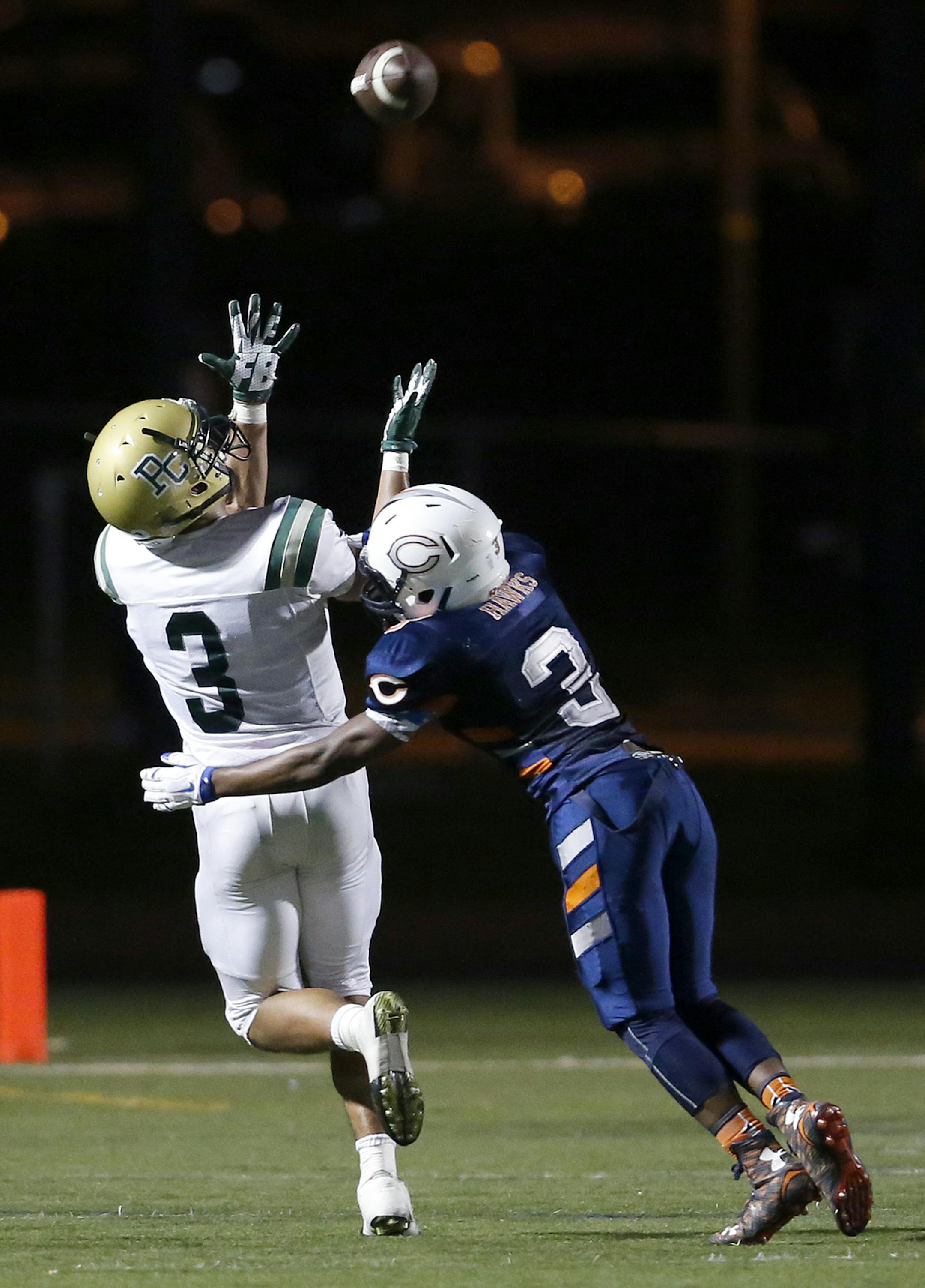 Amani Hooker (3) of Park Center caught a long pass while being defended by Cameron Kipper (3) in the second quarter ] CARLOS GONZALEZ ï cgonzalez@startribune.com - October 20, 2015, New Hope, MN, Cooper High School, Prep football playoff game, Park Center at Cooper