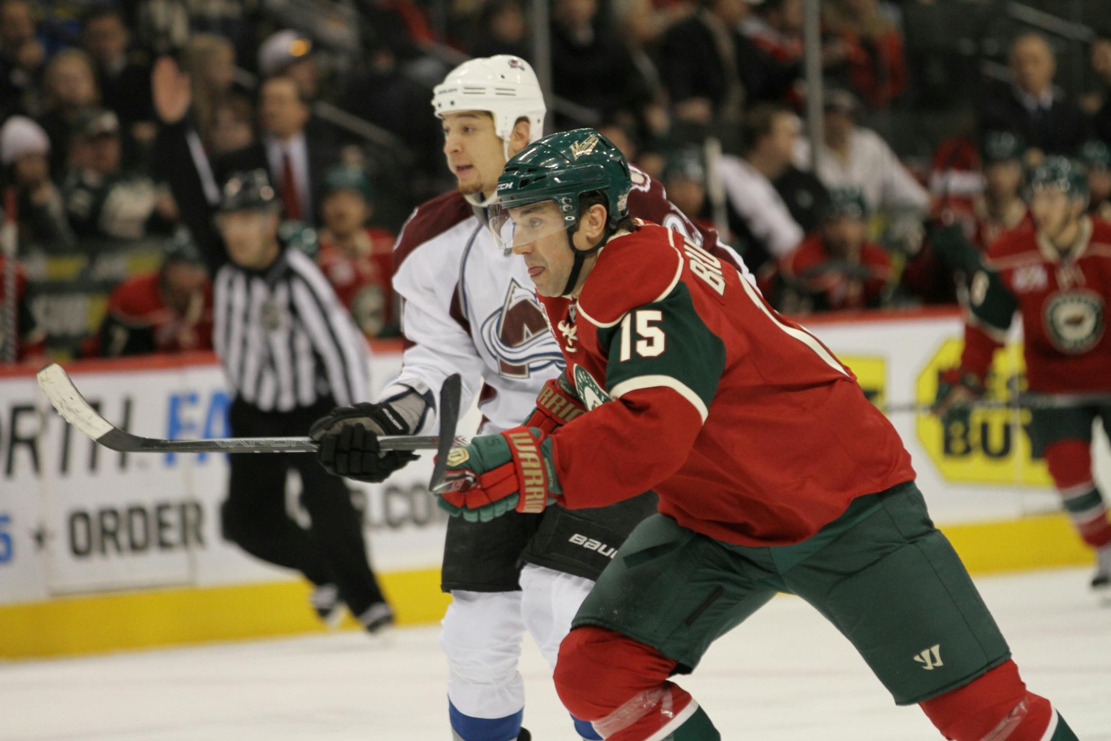 Minnesota Wild forward Andrew Brunette races toward the puck against Chris Stewart of the Colorado Avalanche during the first period at the Xcel Energy Center in St. Paul, Minn. Brunette was honored during a pre-game ceremony for playing in his 1,000th game. Brunette reached the mark in a game played on Feb. 1, 2011.