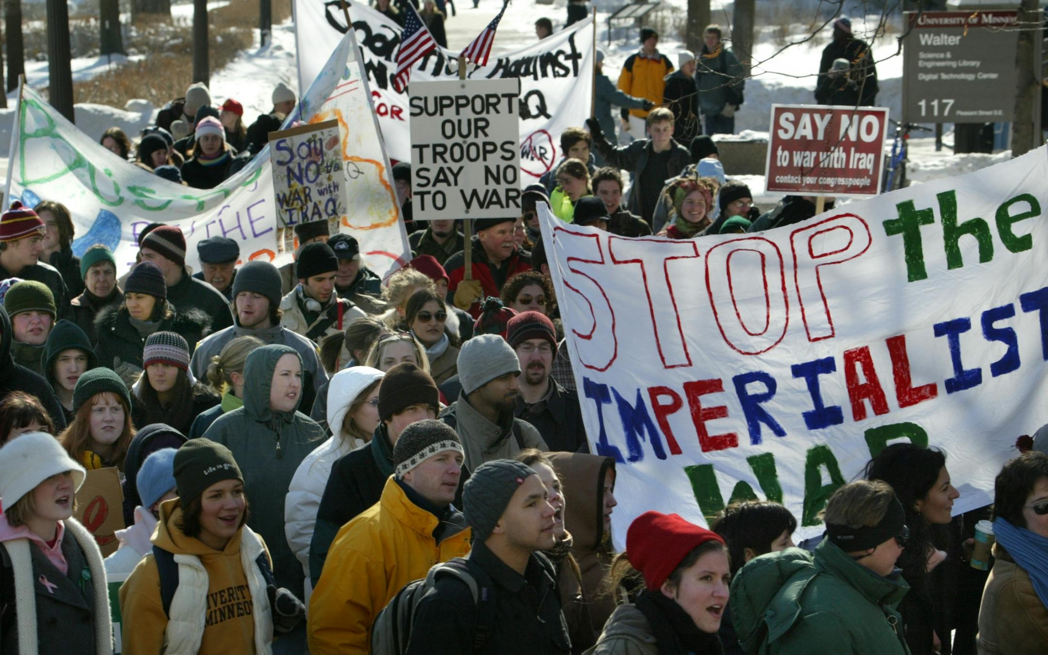 Minneapolis University of Minnesota 2/13/2003--Anti War/Peace Rally and march from Coffman Union through Dinkey Town. Approximately 150 students and faculty with a number of long time activists walked their walk and later took part in an organized speak out.