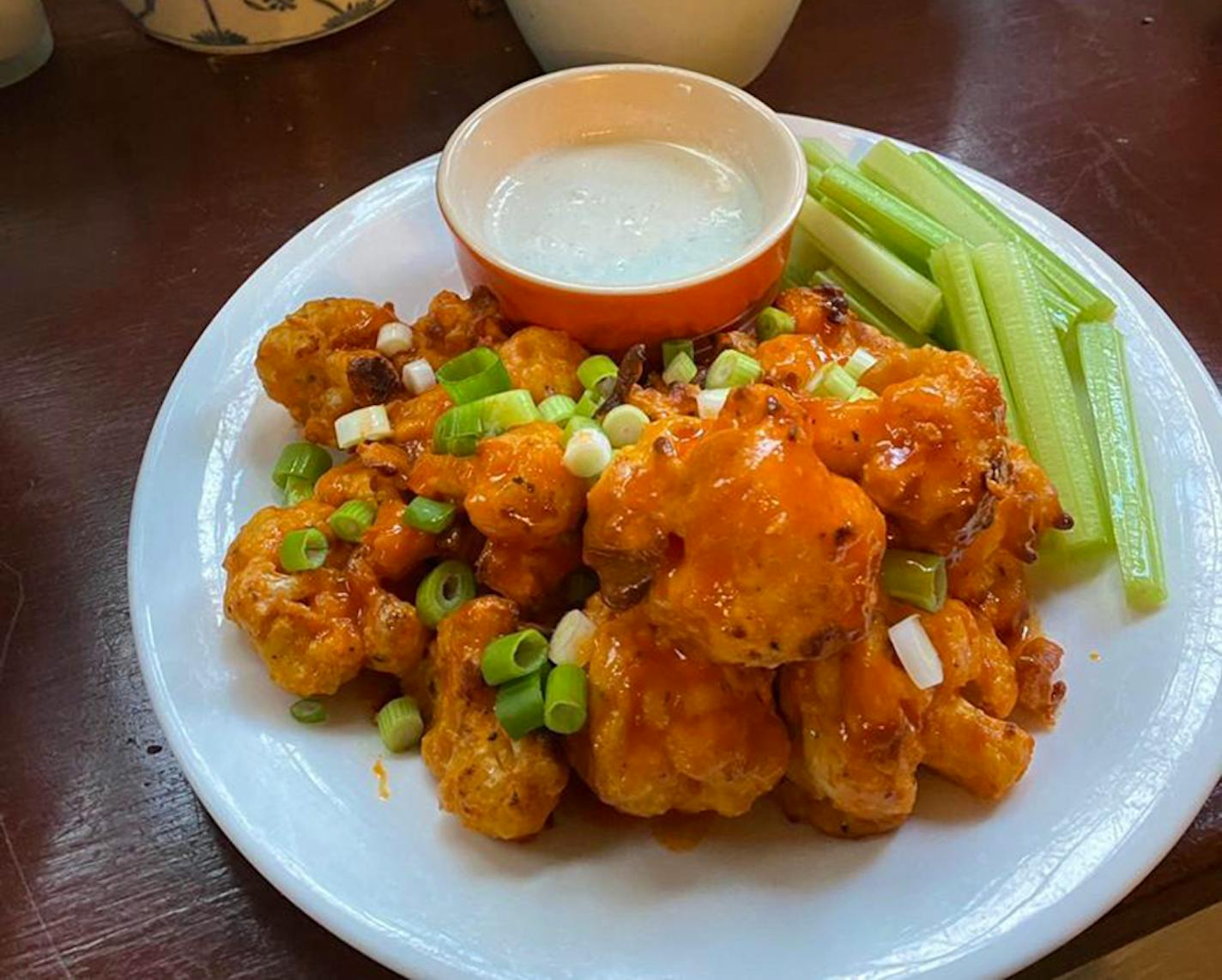 Cauliflower makes a meaty stand-in for chicken in meatless wings. Provided