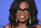 FILE - In this Jan. 7, 2018, file photo, Oprah Winfrey poses in the press room with the Cecil B. DeMille Award at the 75th annual Golden Globe Awards 