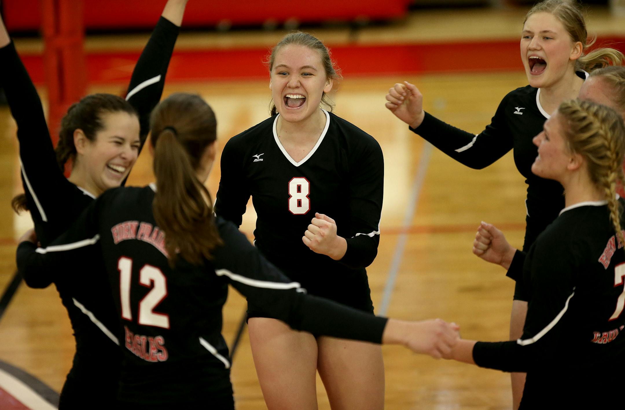 Eden Prairie's Elizabeth Mohr celebrated with the rest of her team. ] (KYNDELL HARKNESS/STAR TRIBUNE) kyndell.harkness@startribune.com Sectional finals Eden Prairie vs Wayzata in St. Louis Park Min., Saturday, November 1, 2014. Eden Prairie won over Wayzata 3-0.