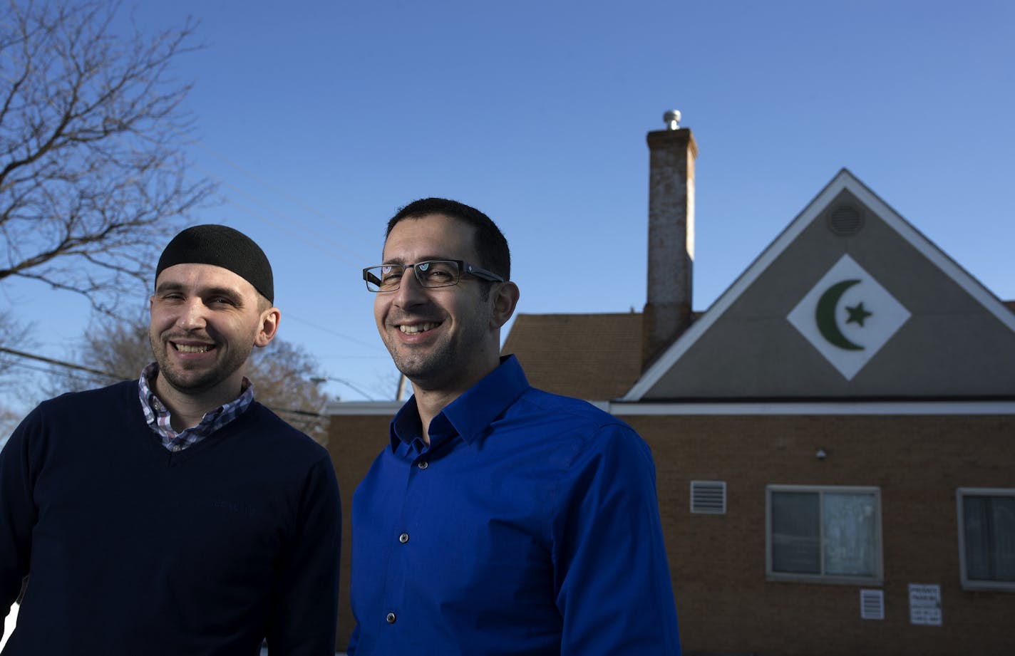 "People of all religions have helped my family," said Bosnian immigrant Enes Gluhi, right, with Imam Jasmin Suljkanovic. "I have never felt the hatred and animosity that I do now."