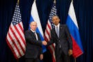 United States President Barack Obama, right, and Russia's President President Vladimir Putin pose for members of the media before a bilateral meeting 