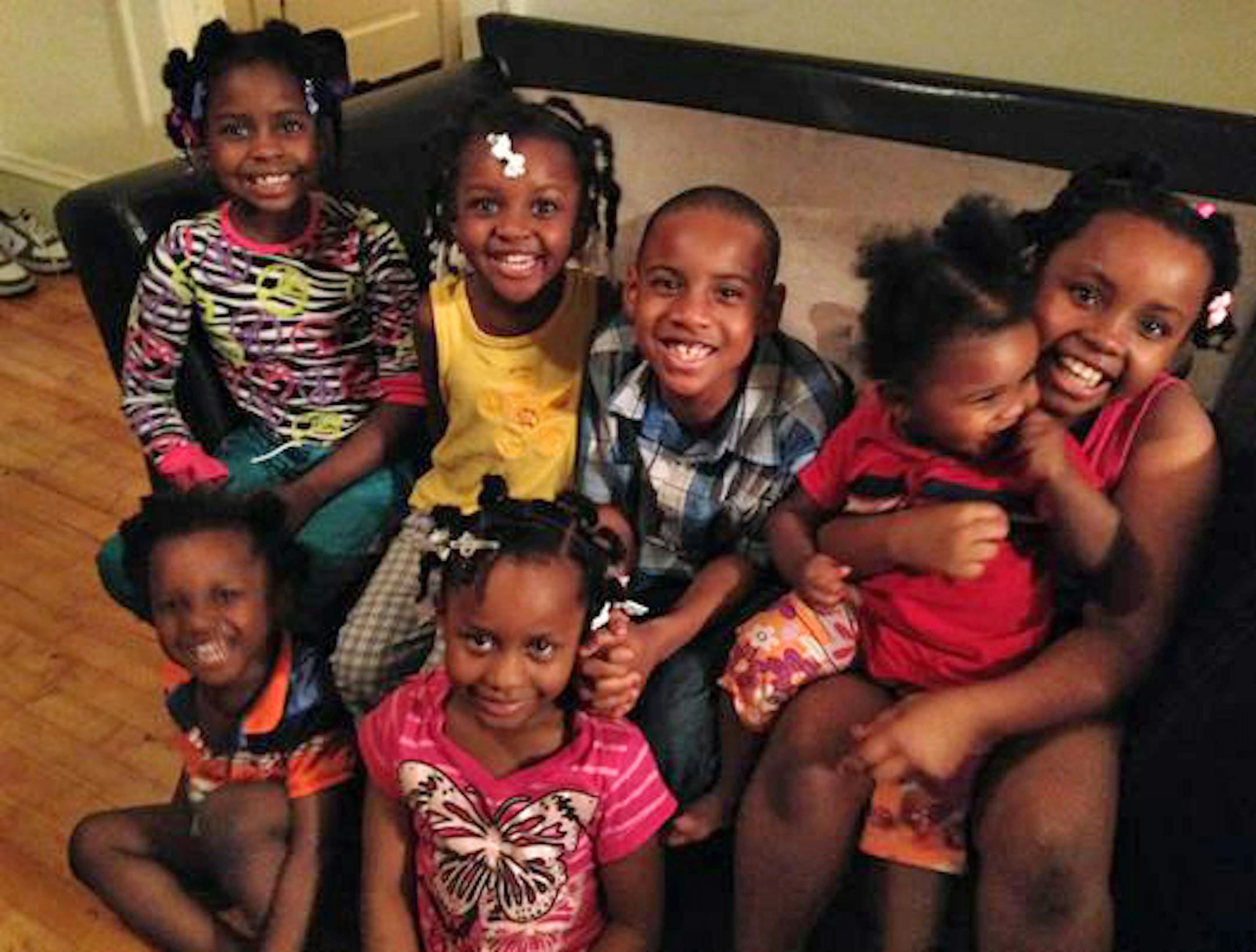 CAPTION: The Lewis family children. In front: Troy, left, and Electra. In back from left: Mary, Fannie, Christopher, Gwendolyn and Shaca. Only Electra and Shaca among the Lewis children survived the fire. CREDIT: Provided by the Lewis family