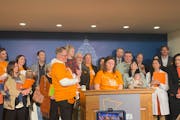 Miraya Gran spoke at the Capitol in support of legislation that would require health plans to provide coverage for infertility treatment. Her husband,