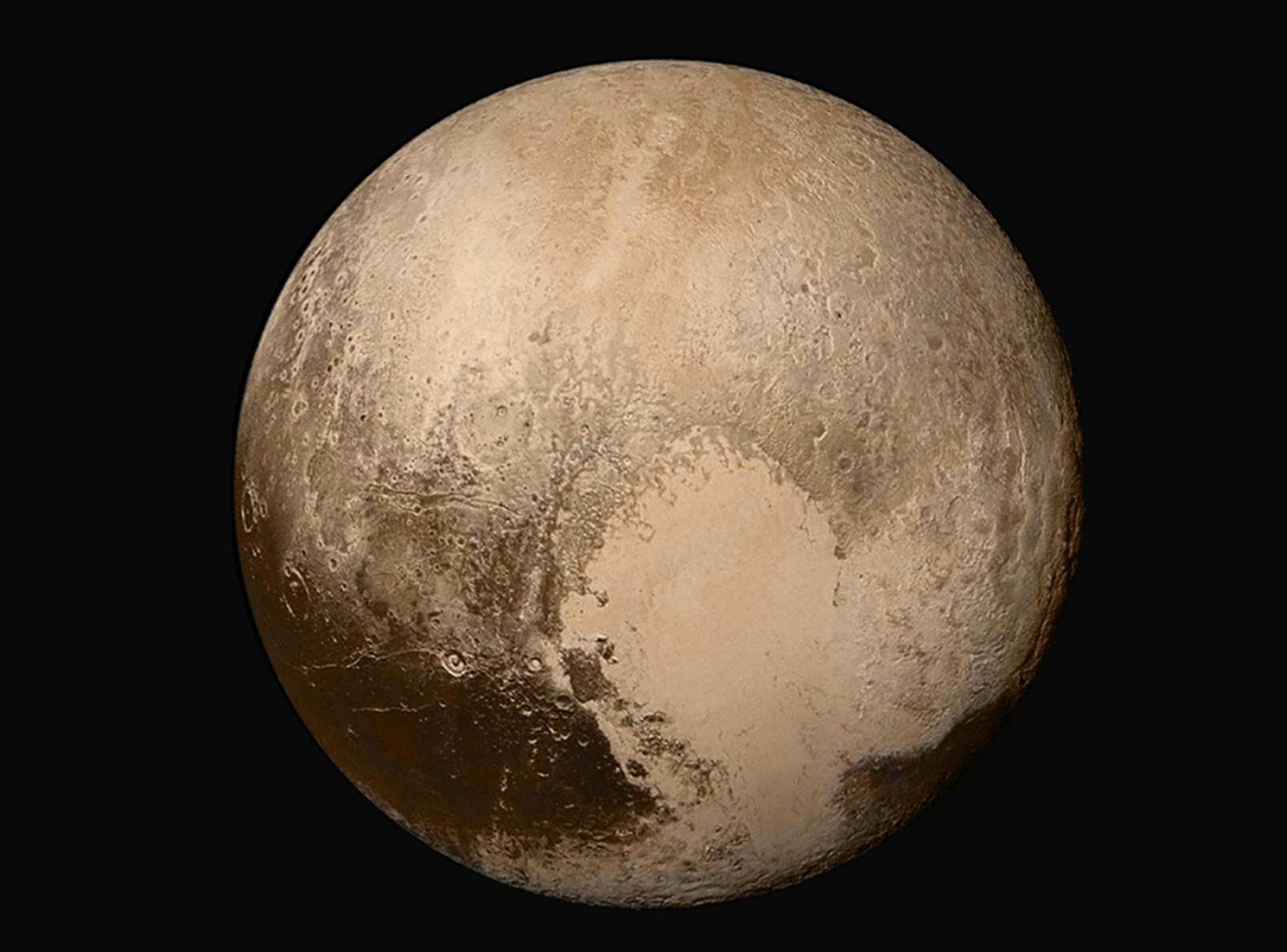 Four images from New Horizons' Long Range Reconnaissance Imager (LORRI) were combined with color data from the Ralph instrument to create this sharper global view of Pluto. The images were taken when the spacecraft was 280,000 miles away and show features as small as 1.4 miles. (NASA/JHUAPL/SwRI)
