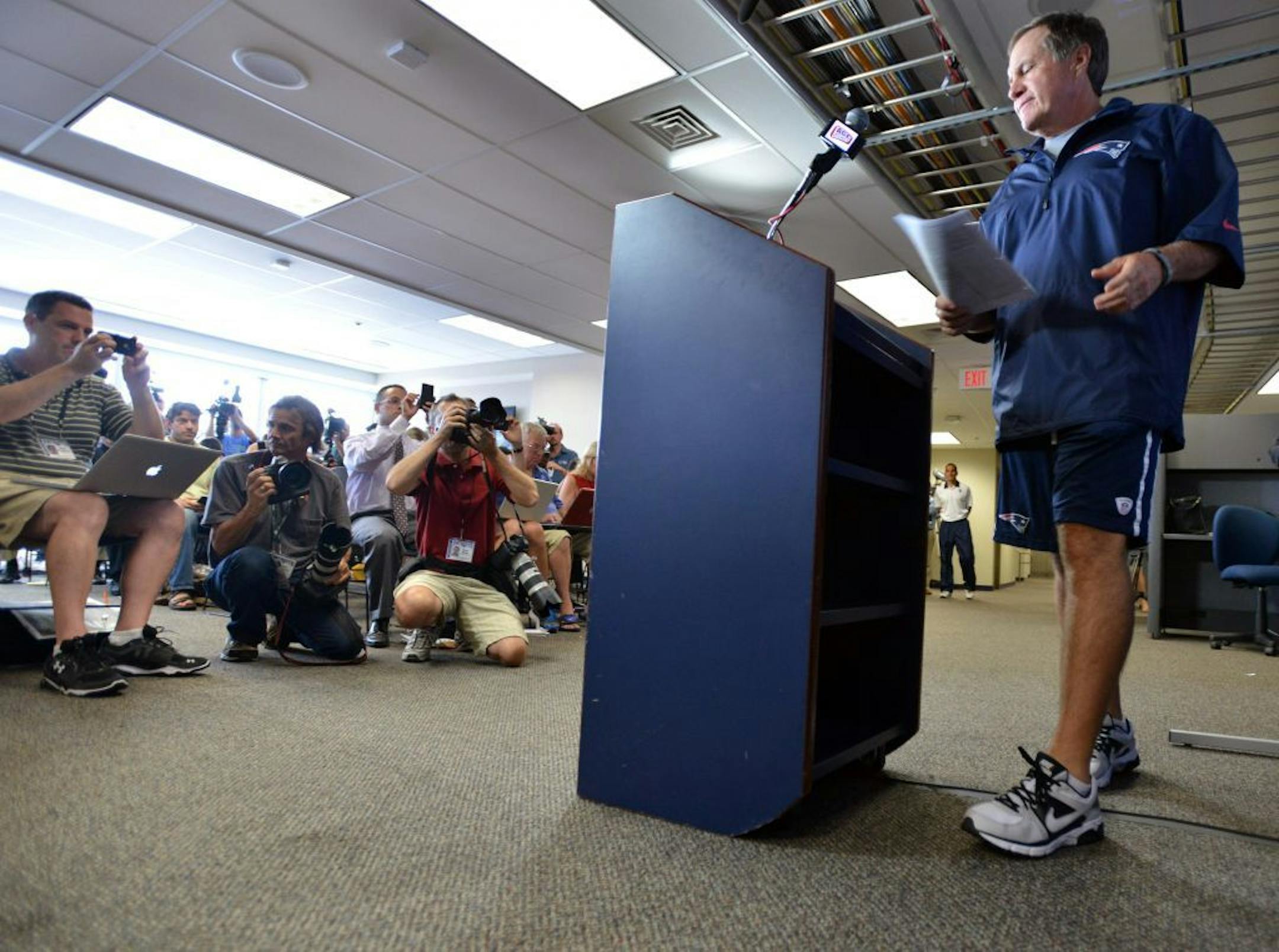 New England Patriots NFL football head coach Bill Belichick arrives to speak to reporters in Foxborough, Mass., Wednesday, July 24, 2013. Belichick broke his silence four weeks after former Patriots tight end Aaron Hernandez was charged with murder. Belichick says the Patriots will learn from "this terrible experience," and that it's time for New England to "move forward."