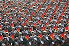 FILE - In this Sept. 21, 2016 file photo, Iran's Revolutionary Guard troops march in a military parade marking the 36th anniversary of Iraq's 1980 inv