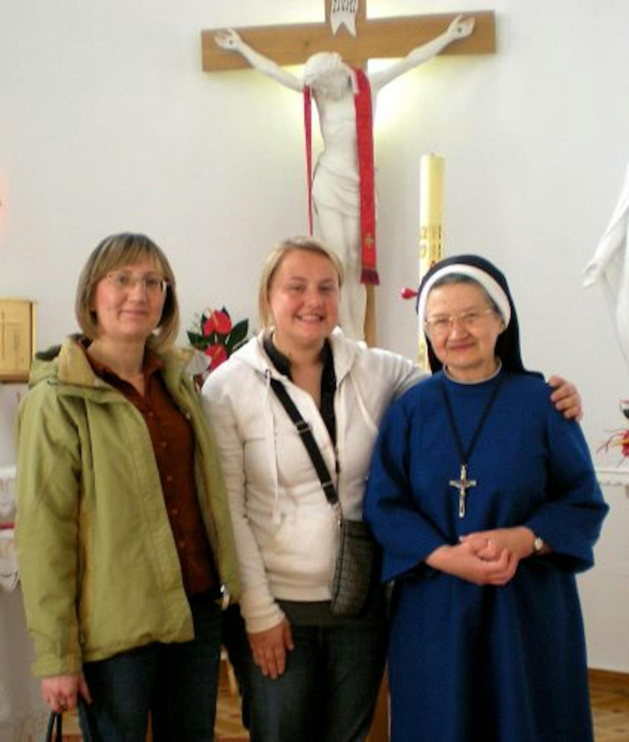 Ania McNamara, center, visited Sister Elizabeth, right, last spring at the orphanage in Chotomow, Poland. Sister Elizabeth recognized McNamara immediately and, with the help of a translator., they talked about her years in the orphanage before her adoption.