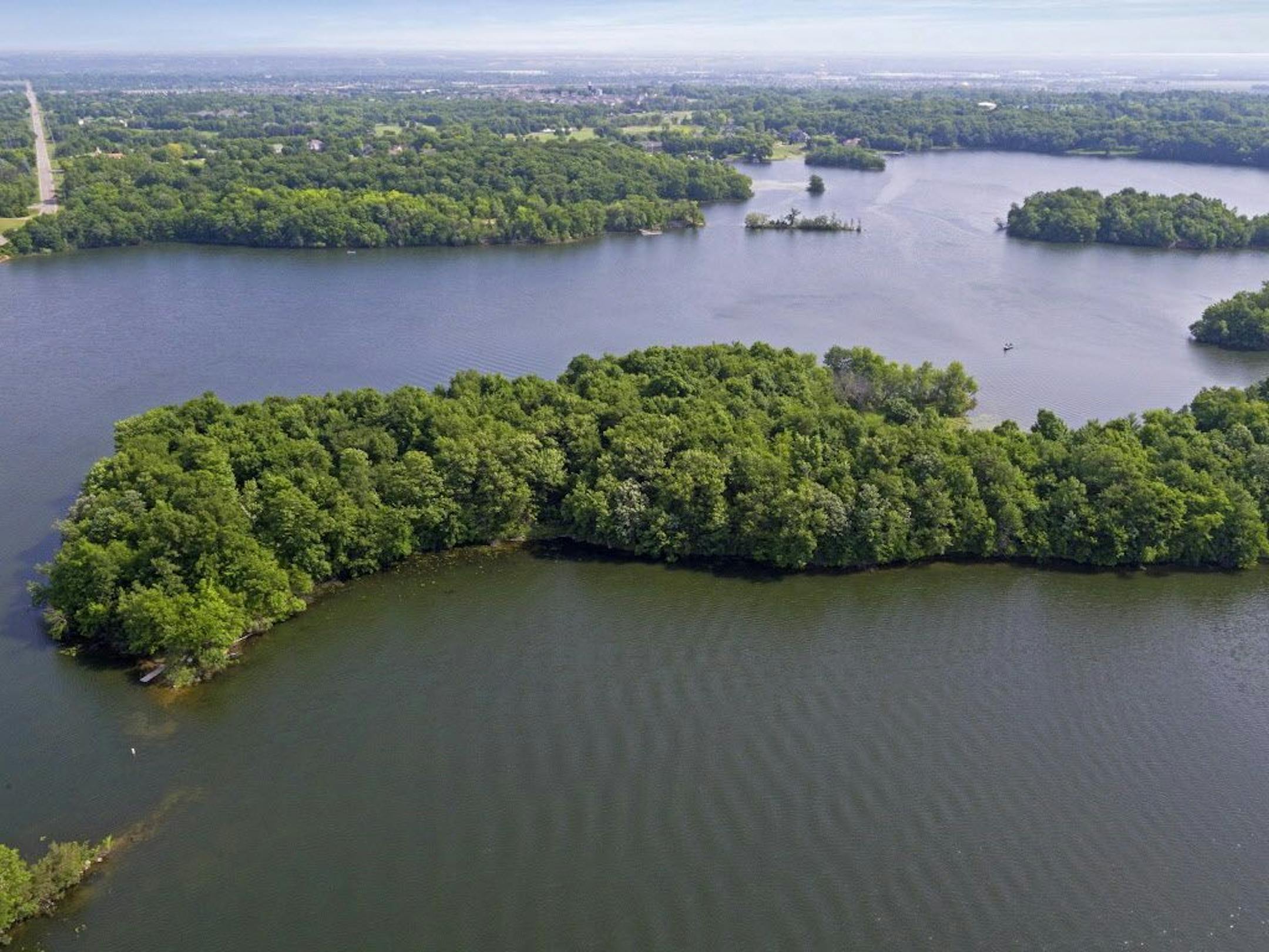 It's a short boat ride across Lake O'Dowd to an island retreat, on the market for $649,900.