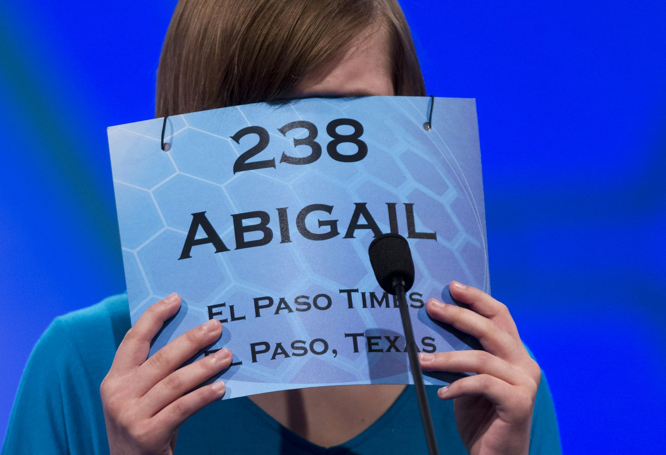 Abigail Violet Spitzer of El Paso, Texas, covers her face as she concentrates during the semifinal round of the National Spelling Bee, Thursday, May 31, 2012, in Oxon Hill, Md. She's an example of a great speller!