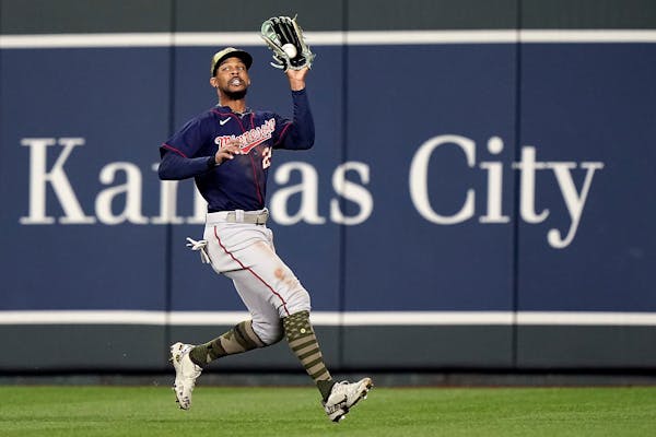 Minnesota Twins center fielder Byron Buxton catches a ball for the out on a sacrifice fly hit by Kansas City Royals' Whit Merrifield during the sevent