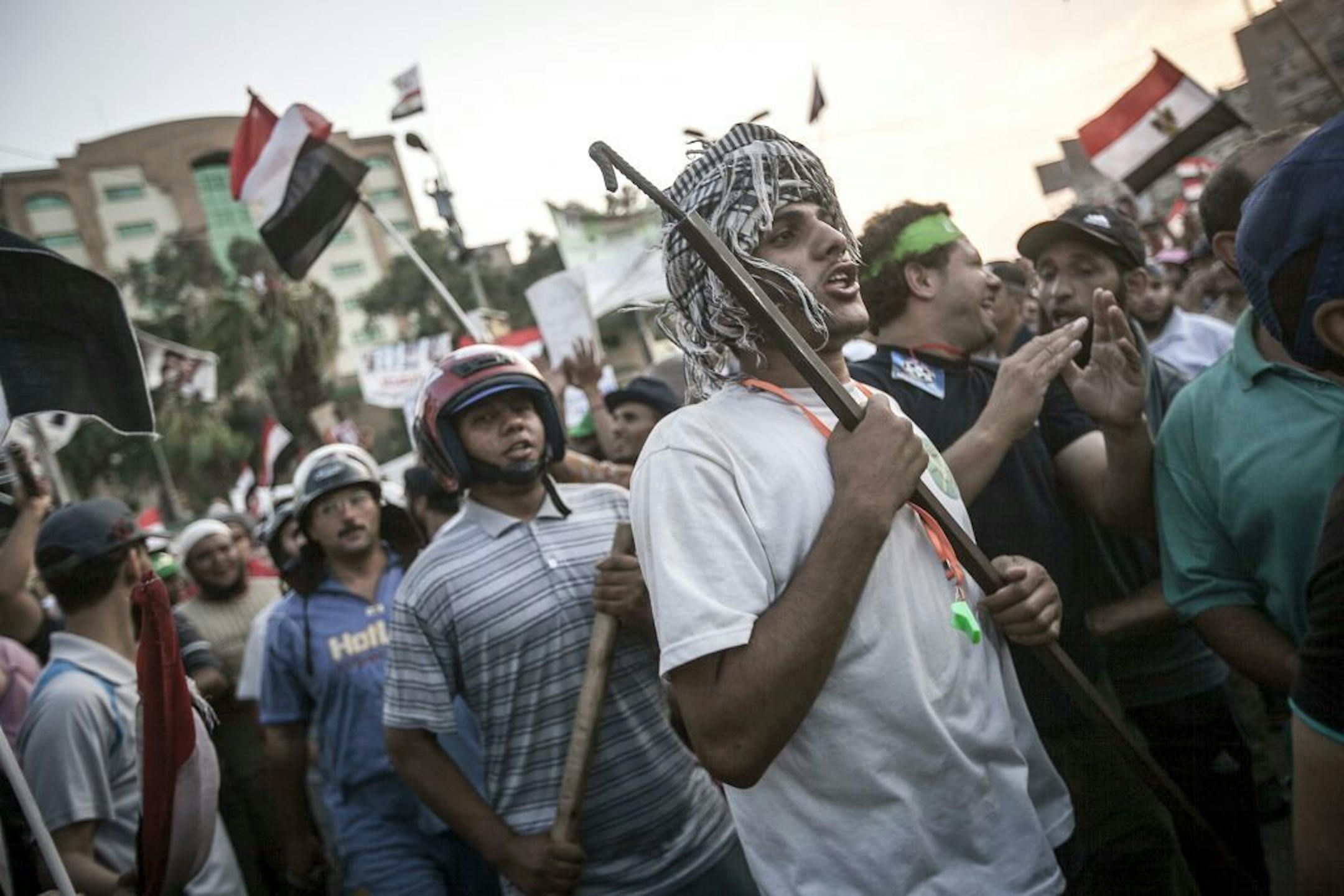 Supporters of Mohammed Morsi, the ousted president, demonstrate near the Rabaa al-Adawiya mosque in Cairo, July 9, 2013. The country's interim government's moves Tuesday � choosing Hazem el-Beblawi, a liberal economist, as temporary prime minister and setting a six-month election timetable � were rejected as illegitimate by the Muslim Brotherhood.