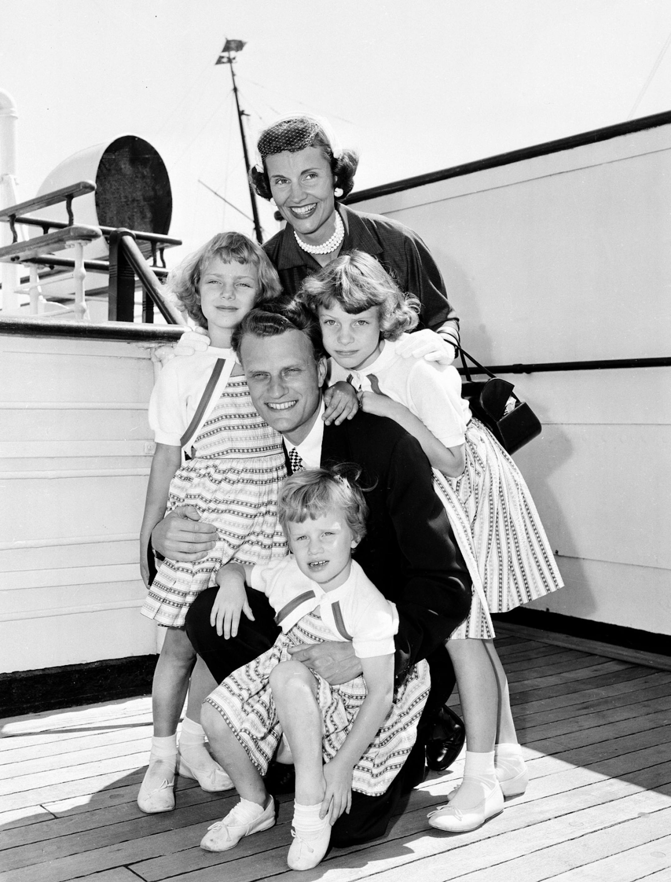 Evangelist Billy Graham poses with his his wife, Ruth, and their three daughters on the Queen Mary following his arrival in New York in this July 7, 1954 file photo. The daughters are, Ruth, 3, in front, Anne, 6, left, and Virginia, 8. Graham, who surrendered dreams of missionary work in Tibet to marry a suitor who became the world's most renowned evangelist, died Thursday, June 14, 2007. She was 87.