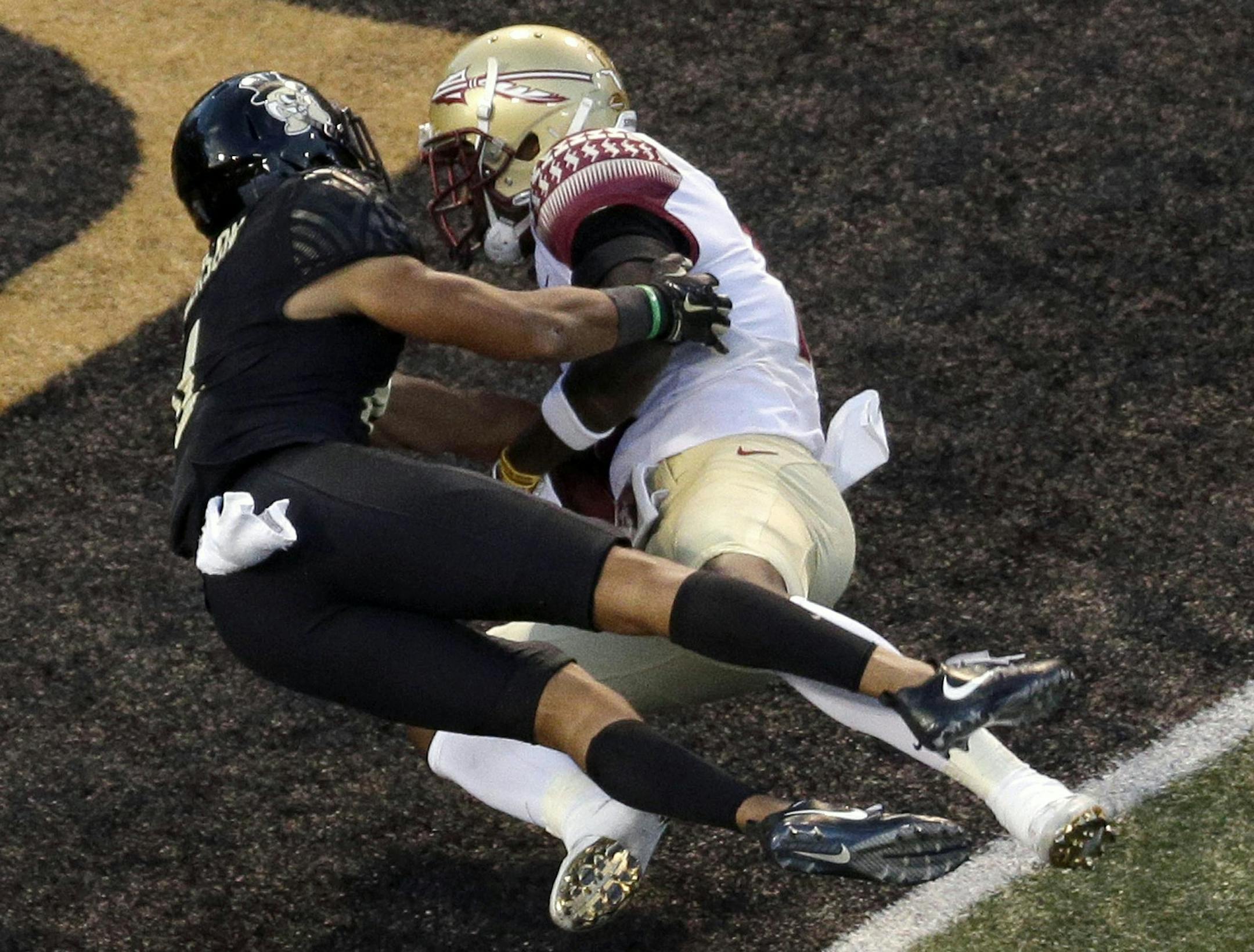 Florida State's Auden Tate, right, catches a touchdown pass as Wake Forest's Amari Henderson, left, defends late in the second half of an NCAA college football game in Winston-Salem, N.C., Saturday, Sept. 30, 2017. (AP Photo/Chuck Burton)