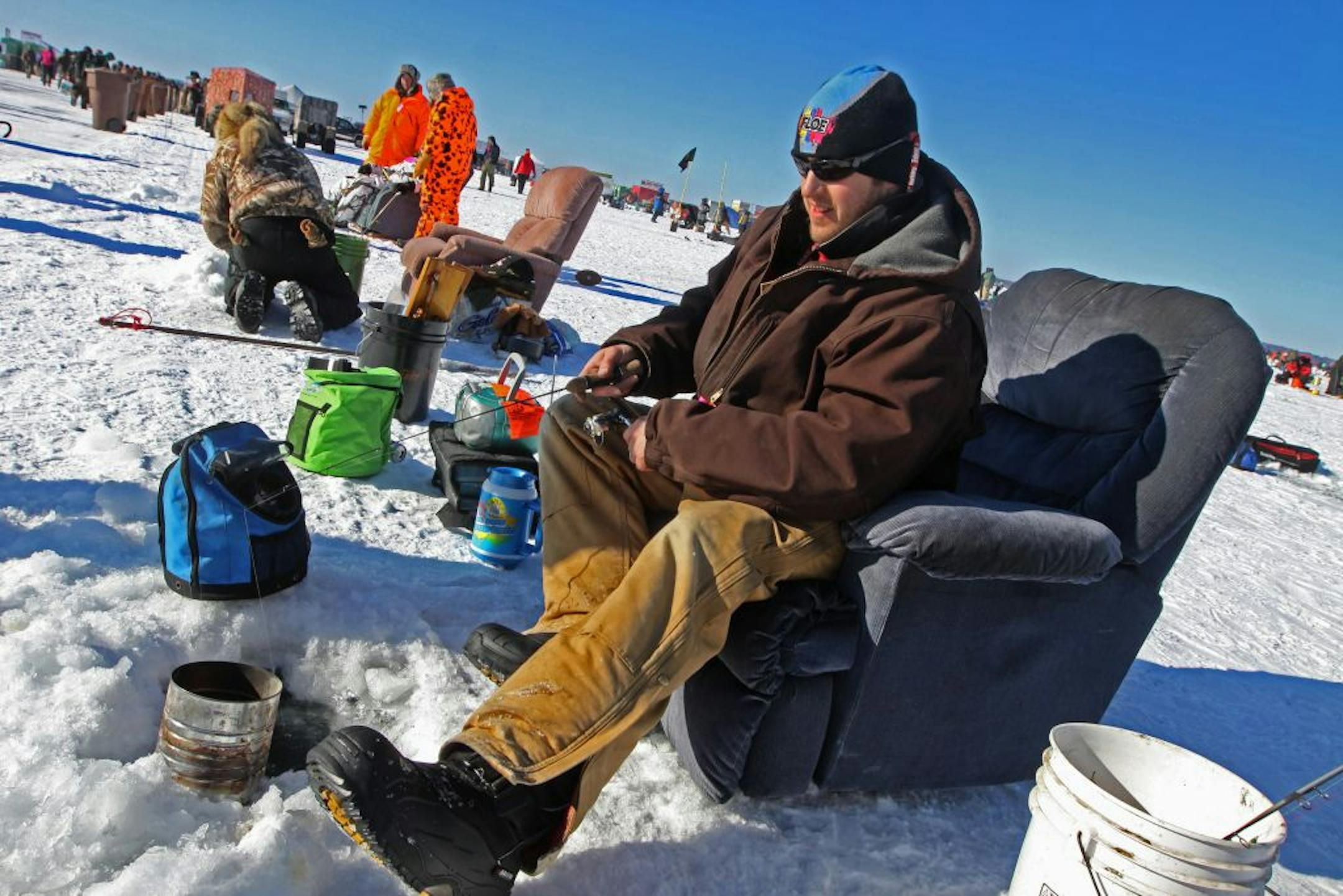 Joe Goble of Fort Ripley MN. brought all the comforts of home as he fished from a recliner during the largest charitable ice fishing contest in the world. More than 10,000 anglers from Minnesota and surrounding states took part in the 22nd Annual Brainerd Jaycees $150,000 Ice Fishing Extravaganzathe event on 2/11/12 on Hole in the Day Bay on Gull Lake in Brainerd. The event had been posponed from the orginal date of January 21st. due to poor ice conditions. The anglers compete for nearly $220,00