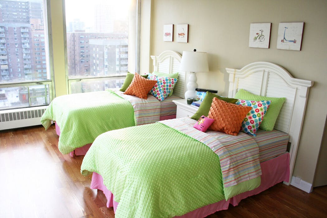 Add color to a bedroom with fun bedding and throw pillows.