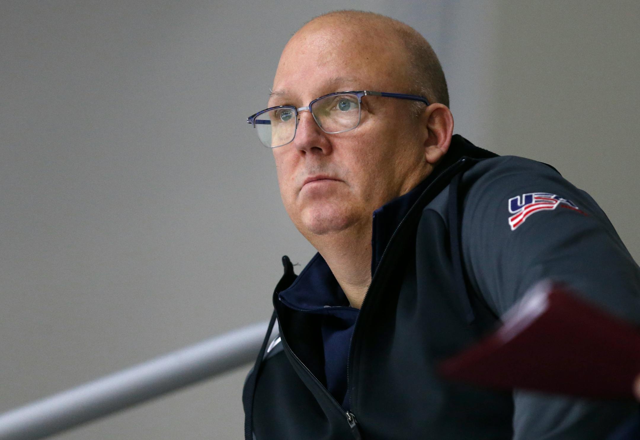 In this Sunday, Dec. 17, 2017 photo, United States' under-20 hockey coach Bob Motzko watches his team scrimmage during hockey practice in Columbus, Ohio. Expectations will be high when the US team defends its title on home soil at the World Junior tournament, starting the day after Christmas in Buffalo, N.Y. (AP Photo/Jay LaPrete)