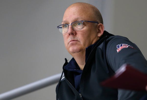 In this Sunday, Dec. 17, 2017 photo, United States' under-20 hockey coach Bob Motzko watches his team scrimmage during hockey practice in Columbus, Oh