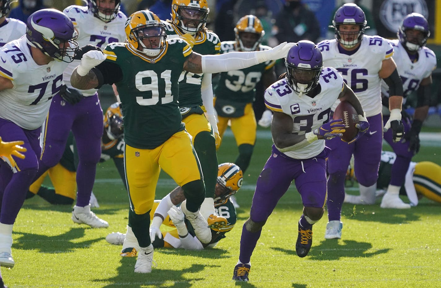 Minnesota Vikings running back Dalvin Cook (33) broke past the Green Bay Packers defense as he ran the ball in for a touchdown in the third quarter. ] ANTHONY SOUFFLE • anthony.souffle@startribune.com The Minnesota Vikings played the Green Bay Packers, sans fans to comply with restrictions meant to slow the spread of COVID-19, Sunday, Nov. 1, 2020 at Lambeau Field in Green Bay, Wis.