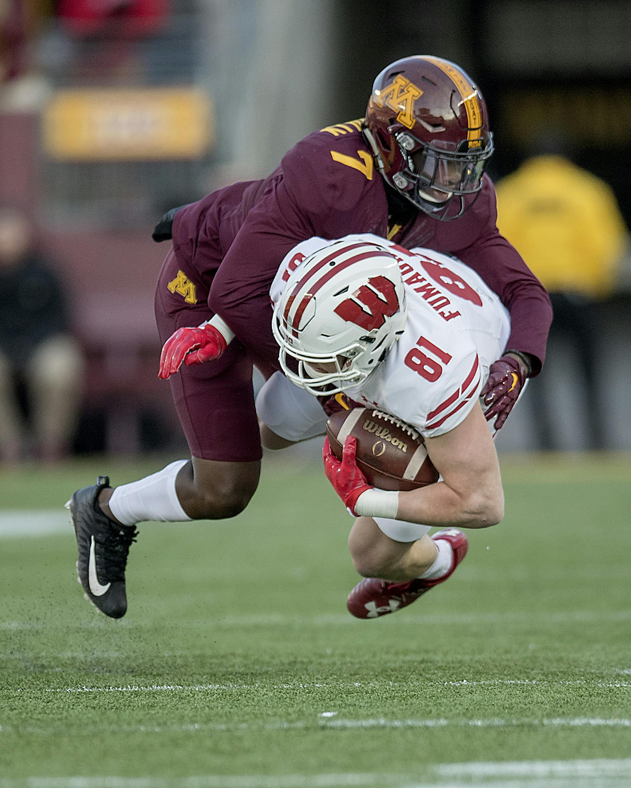 Minnesota's defensive back Ken Handy-Holly tackled Wisconsin's tight end Troy Fumagalli during the first quarter as Minnesota took on Wisconsin at TCF Bank Stadium, Saturday, November 20 2017 in Minneapolis, MN. ] ELIZABETH FLORES ï liz.flores@startribune.com