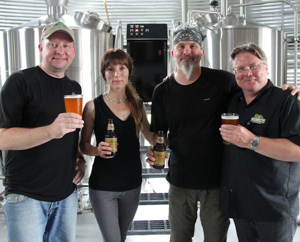 Summit brewer Mike Lundell, left, and founder Mark Stutrud, right, with Sandy and Jay Boss Febbo of Bang Brewing.