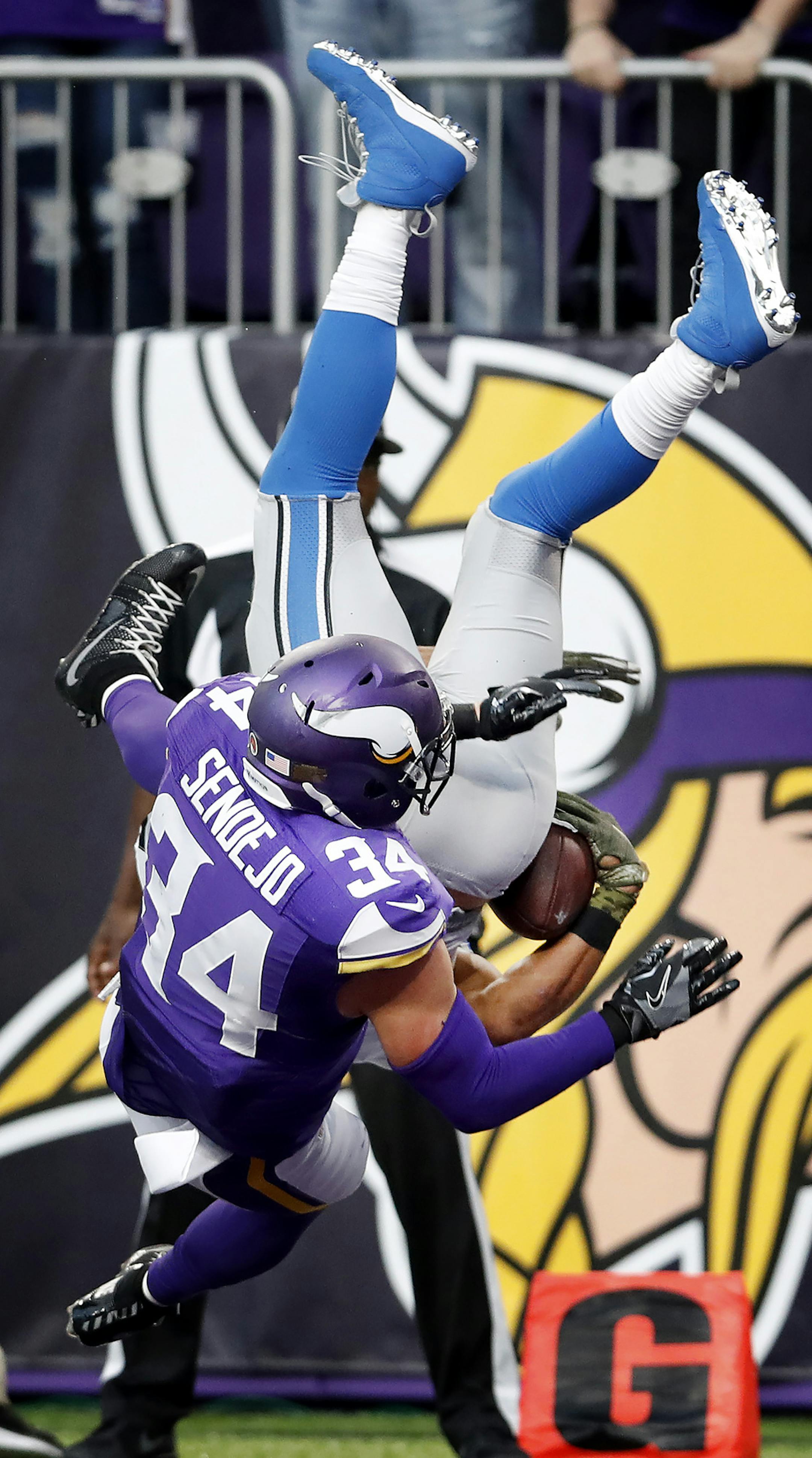 Andrew Sendejo (34) hit Golden Tate (15) as he leapt into the end zone to score the winning touchdown in overtime. Detroit beat Minnesota by a final score of 22-16. ] CARLOS GONZALEZ cgonzalez@startribune.com - November 6, 2016, Minneapolis, MN, US Bank Stadium, NFL, Minnesota Vikings vs. Detroit Lions
