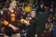 U of M head coach Keegan Cook keeps an eye on the game in Minneapolis, Minn., on Tuesday, April 4, 2023. The Gophers play an exhibition game against a