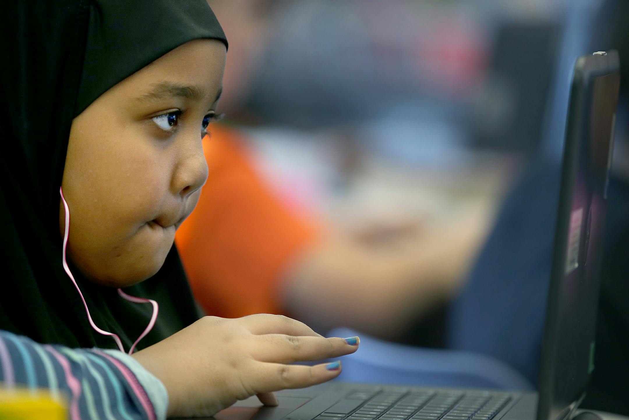 Third-grader Intisar Badri, cq, worked on her coding skills alongside his classmates during the "Hour of Code" at Robbinsdale's School of Engineering and Arts, Monday, December 7, 2015 in Robbinsdale, MN. ] (ELIZABETH FLORES/STAR TRIBUNE) ELIZABETH FLORES • eflores@startribune.com
