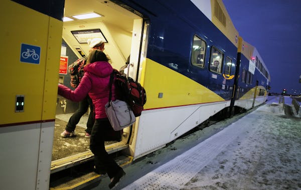 Commuters board the Northstar to Minneapolis at the Big Lake station.