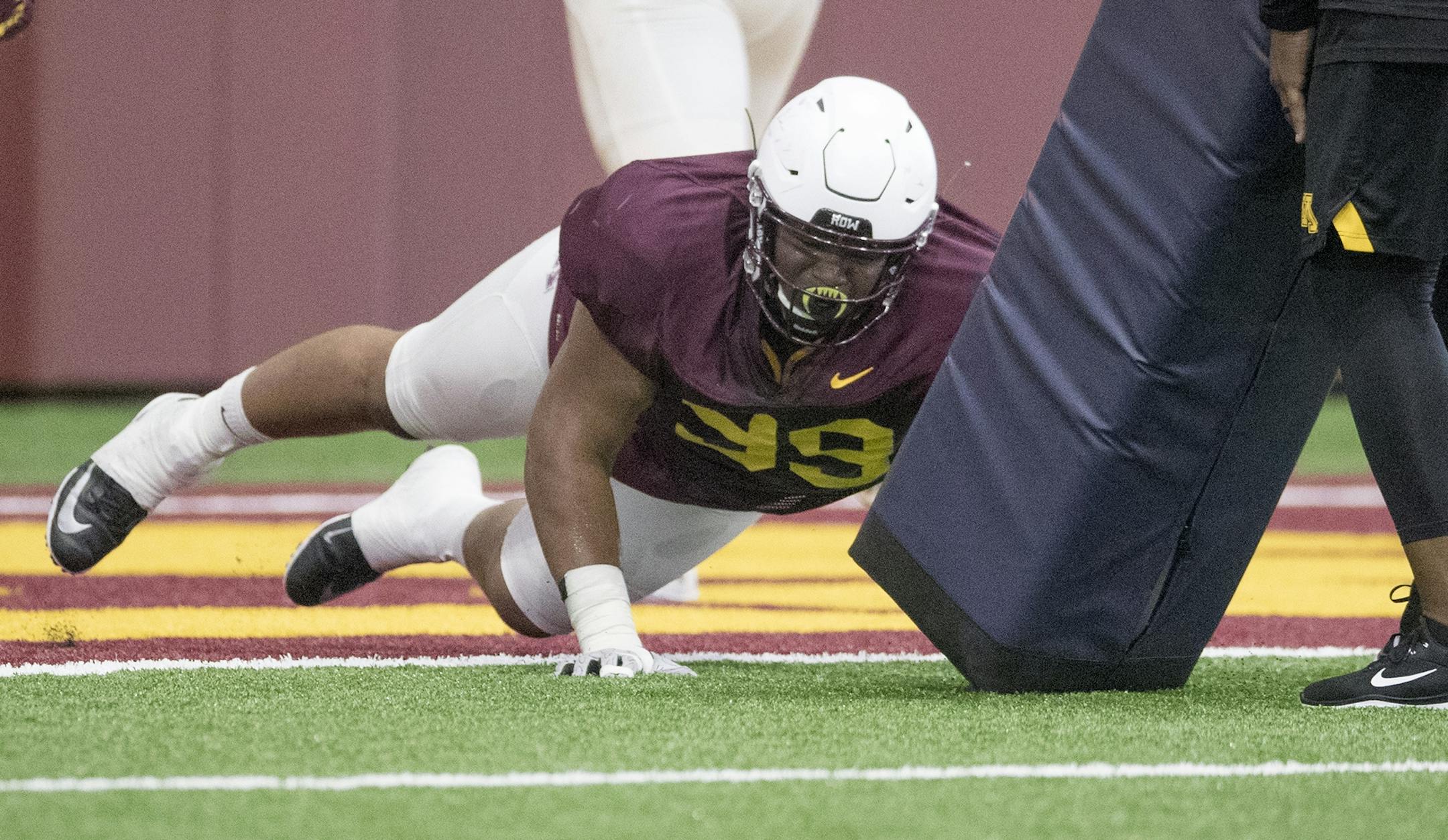 Minnesota's defensive line O.J. Smith, center, took to the field for the first practice that was open to the public at the Athletes Village at the University of Minnesota in Minneapolis, MN.
