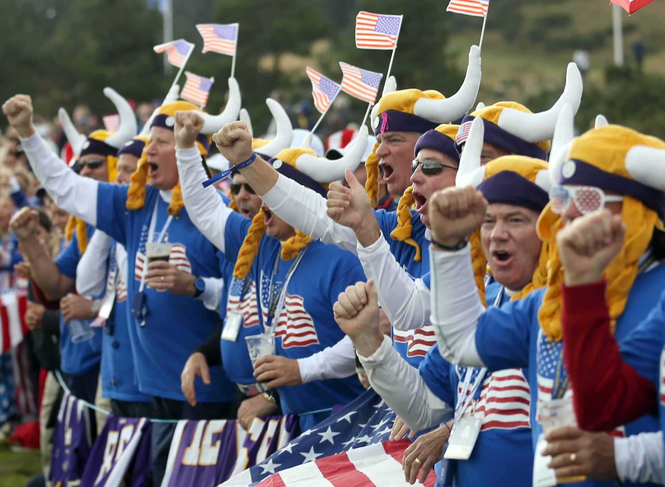NFL Minnesota Vikings fans cheer during the singles matches on the final day of the Ryder Cup golf tournament, at Gleneagles, Scotland, Sunday, Sept. 28, 2014. (AP Photo/Peter Morrison) ORG XMIT: RCUP175