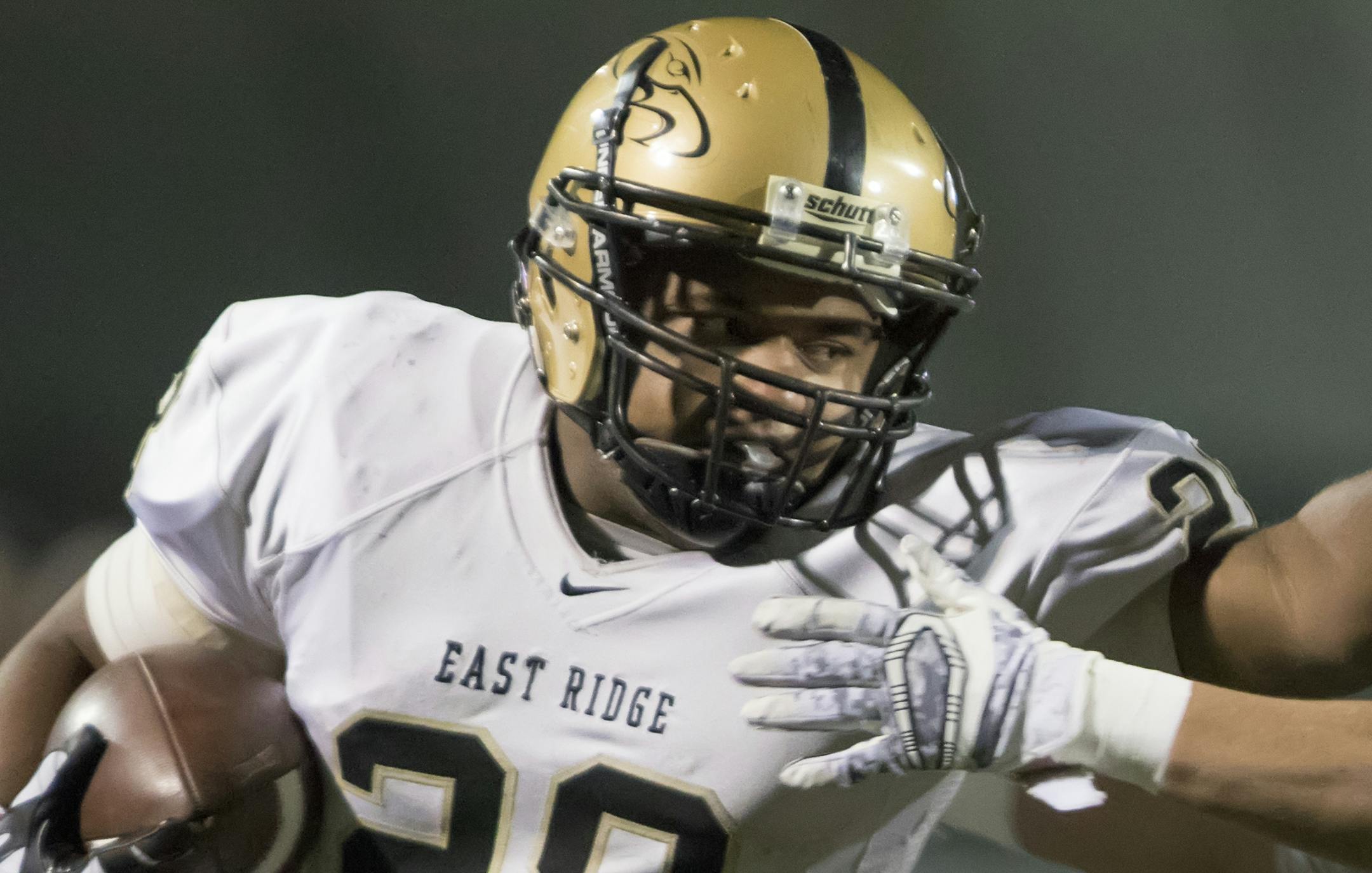 East Ridge running back Dominik London (28) stiffarms Maple Grove running back Isaac Collins (3) after a big gain as the Maple Grove Crimson faced the East Ridge Raptors Class the Class 6A MSHSL Football semifinals. ] MATT BLEWETT ï matt@mattebphoto.com - November 6, 2015, Eden Prairie, MN, East Ridge Raptors, Maple Grove Crimson, Prep Football, East Ridge Raptors vs Maple Grove Crimson, 438977 PREP110715 ORG XMIT: MIN1511062029360203