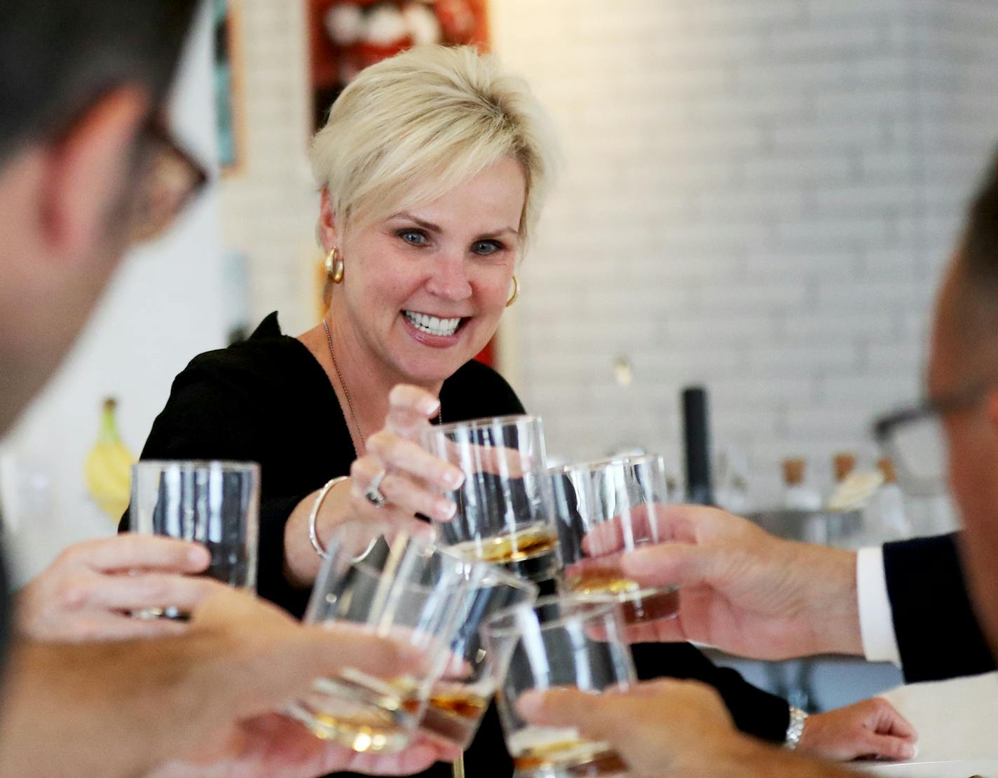 Lynne Robertson, CEO and owner of Fame, toasted with clients and employees working on a marketing strategy after a meeting Wednesday, Aug. 1, 2018, in Minneapolis, MN. Robertson said clients often become like family members.] DAVID JOLES &#xef; david.joles@startribune.com Women lead several of the largest creative advertising shops in the Twin Cities, an unusual feat in an industry where men still hold most of the power in creative ad departments.**Lynne Robertson,cq