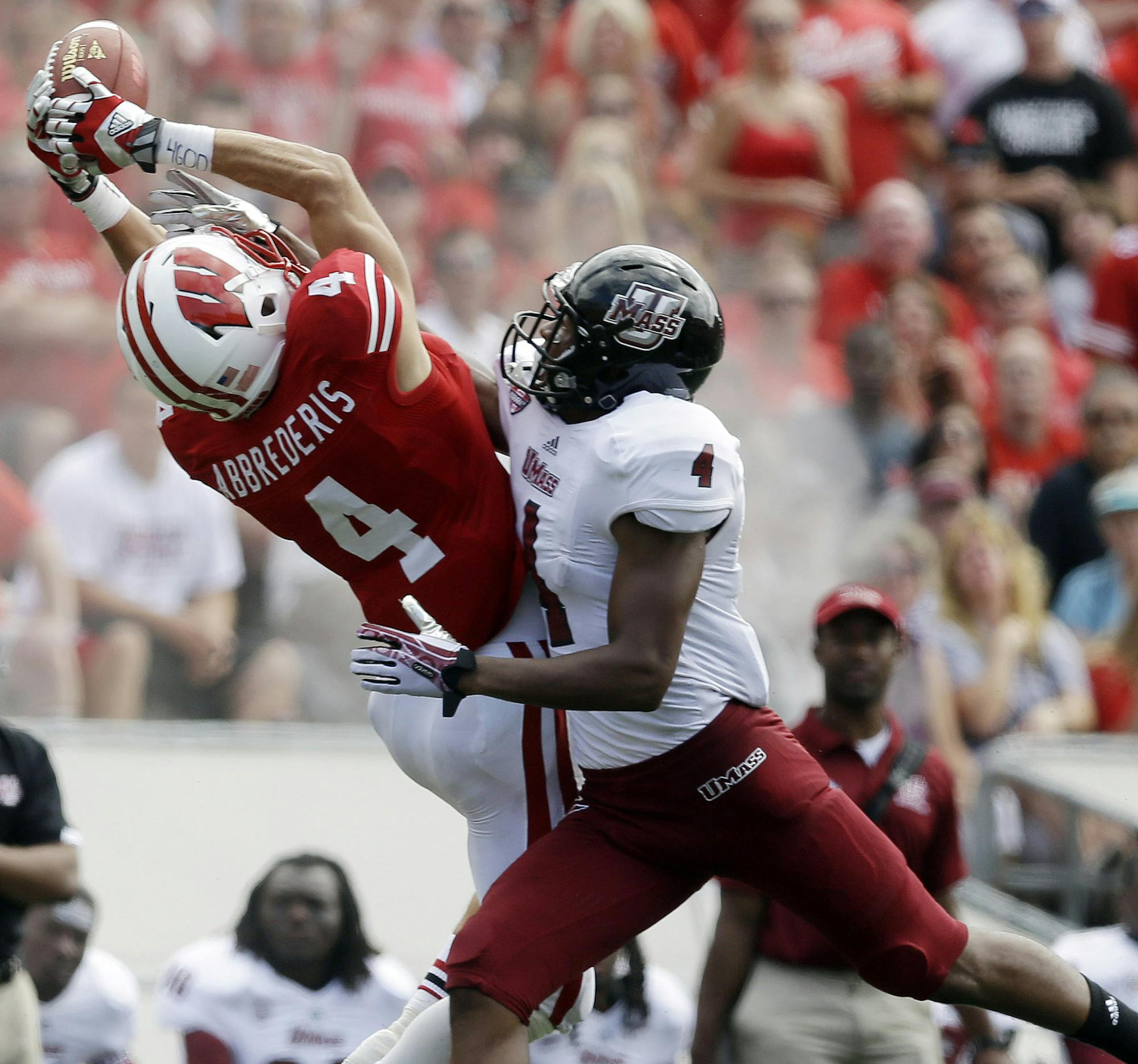 Massachusetts's Randall Jette, right, breaks up a pass intended for Wisconsin's Jared Abbrederis during the second half of an NCAA college football game Saturday, Aug. 31, 2013, in Madison, Wis. Wisconsin won 45-0. (AP Photo/Morry Gash) ORG XMIT: WIMG113