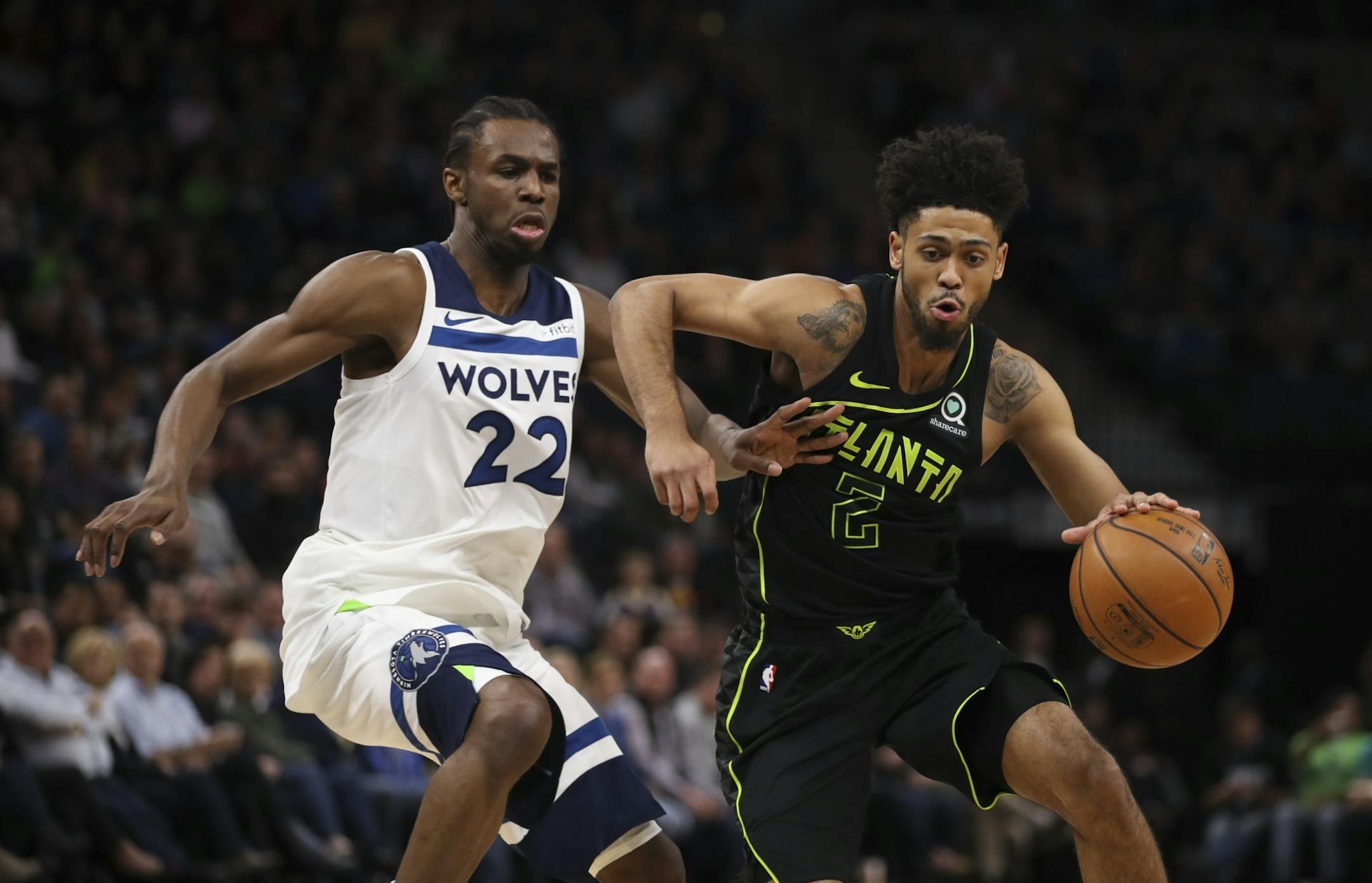 Minnesota Timberwolves forward Andrew Wiggins (22) defended Atlanta Hawks guard Tyler Dorsey (2) in the first quarter.