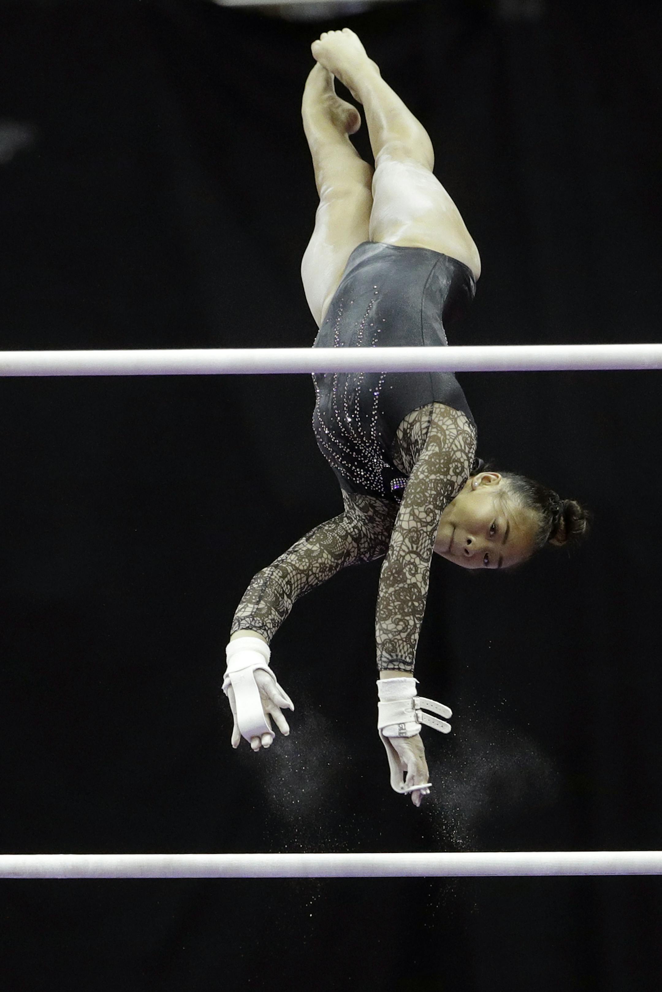 Sunisa Lee competes on the uneven bars during the senior women's competition at the 2019 U.S. Gymnastics Championships Sunday, Aug. 11, 2019, in Kansas City, Mo. Lee finished second in the all-around. (AP Photo/Charlie Riedel)