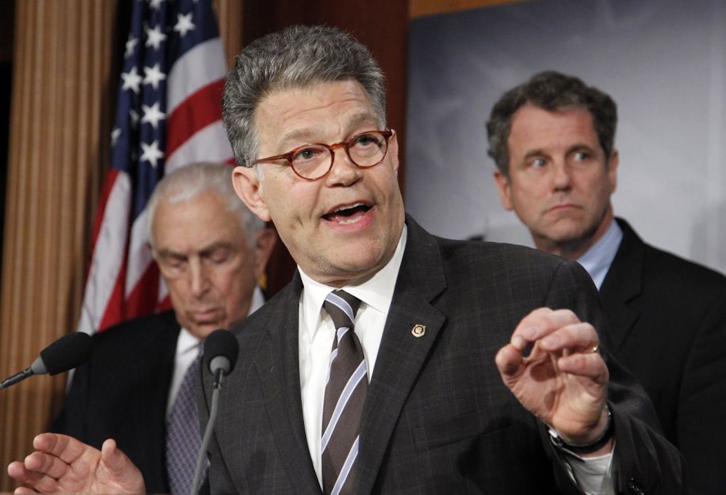 U.S. Sen. Al Franken, D-Minn., (center)