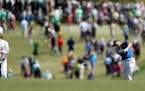 Jordan Spieth hits his second shot from the 1st fairway during the third round of the Masters Tournament at Augusta National Golf Club in Augusta, Ga.