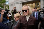 E. Jean Carroll walks out of Manhattan federal court on Tuesday in New York City. A jury found that Donald Trump sexually abused and defamed her, awar