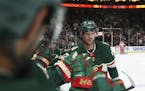 Minnesota Wild center Eric Staal (12) skated past the bench to receive congratulations for tying the game 1-1 on a power play in the second period. ] 