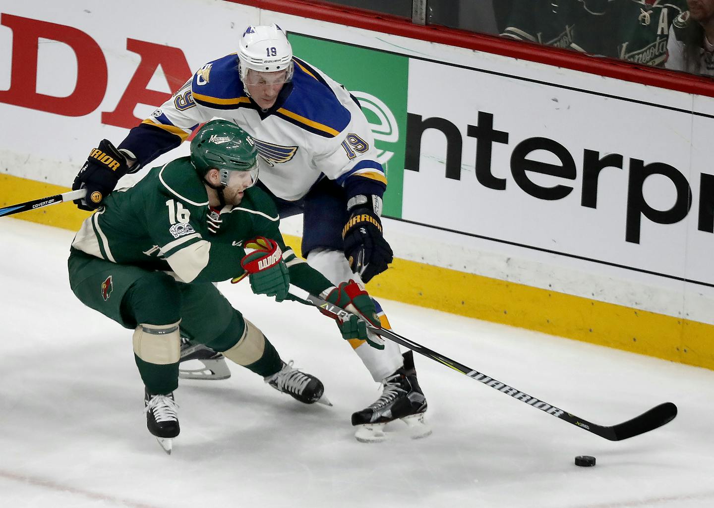 The Minnesota Wild's Jason Zucker (16) and the St. Louis Blues' Jay Bouwmeester (19) battle for the puck in the first period of Game 1 of the Western Conference first-round series on Wednesday, April 12, 2017, at the Xcel Energy Center in St. Paul, Minn. (Carlos Gonzalez/Minneapolis Star Tribune/TNS) ORG XMIT: 1200580