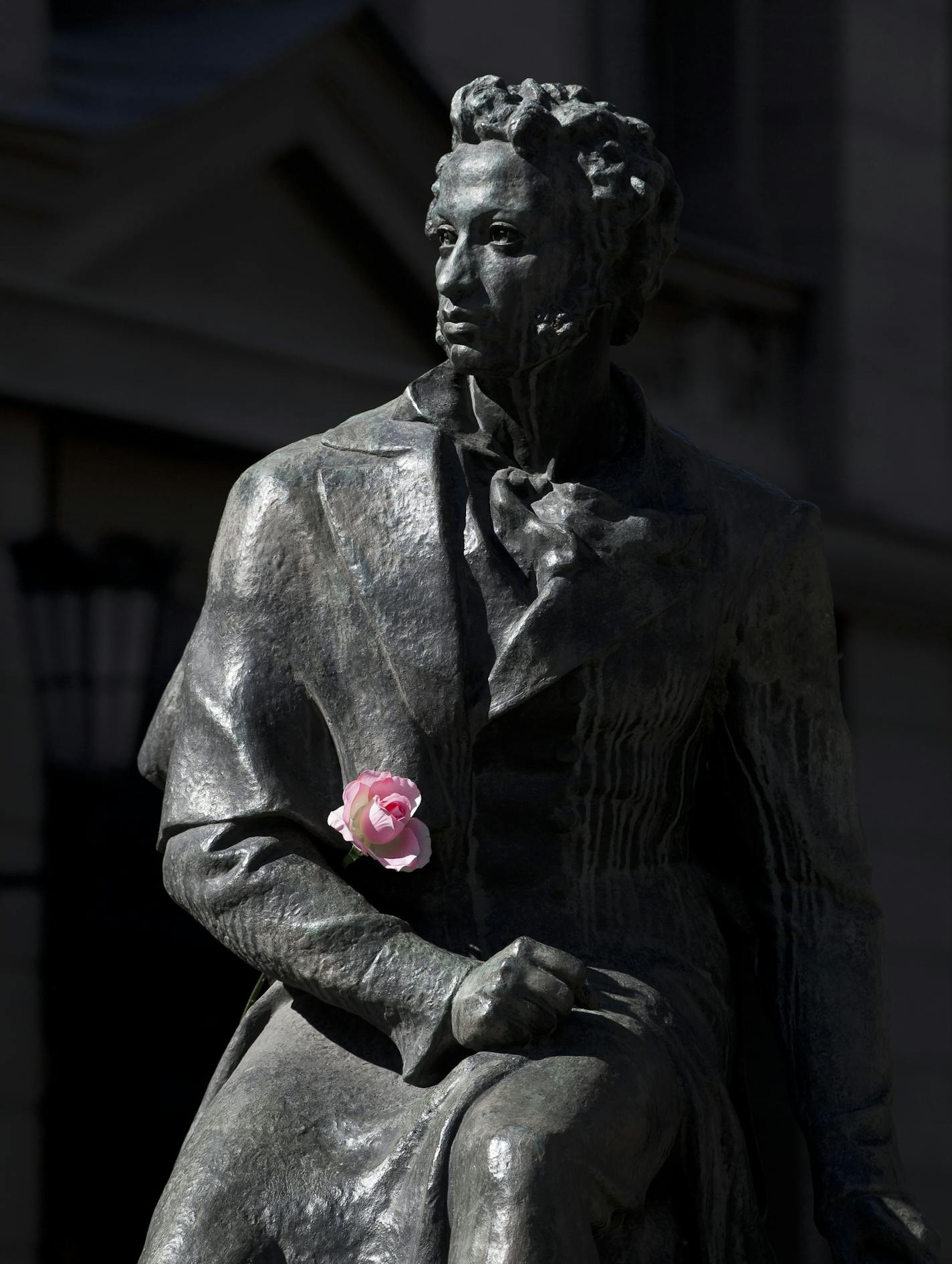 A rose decorates a statue of Russian poet Alexander Pushkin in Simferopol, Ukraine, Thursday, March 13, 2014. Crimea plans to hold a referendum on Sunday that will ask residents if they want the territory to become part of Russia. Ukraine's government and Western nations have denounced the vote as illegitimate and warned Russia against trying to annex the strategic peninsula. (AP Photo/Vadim Ghirda) ORG XMIT: XVG116