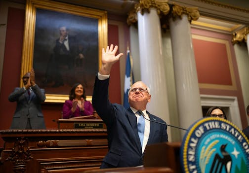 Minnesota Gov. Tim Walz acknowledges applause before delivering his State of the State address to a joint session of the Legislature at the State Capitol in St. Paul, Minnesota, on Wednesday, April 23, 2025.