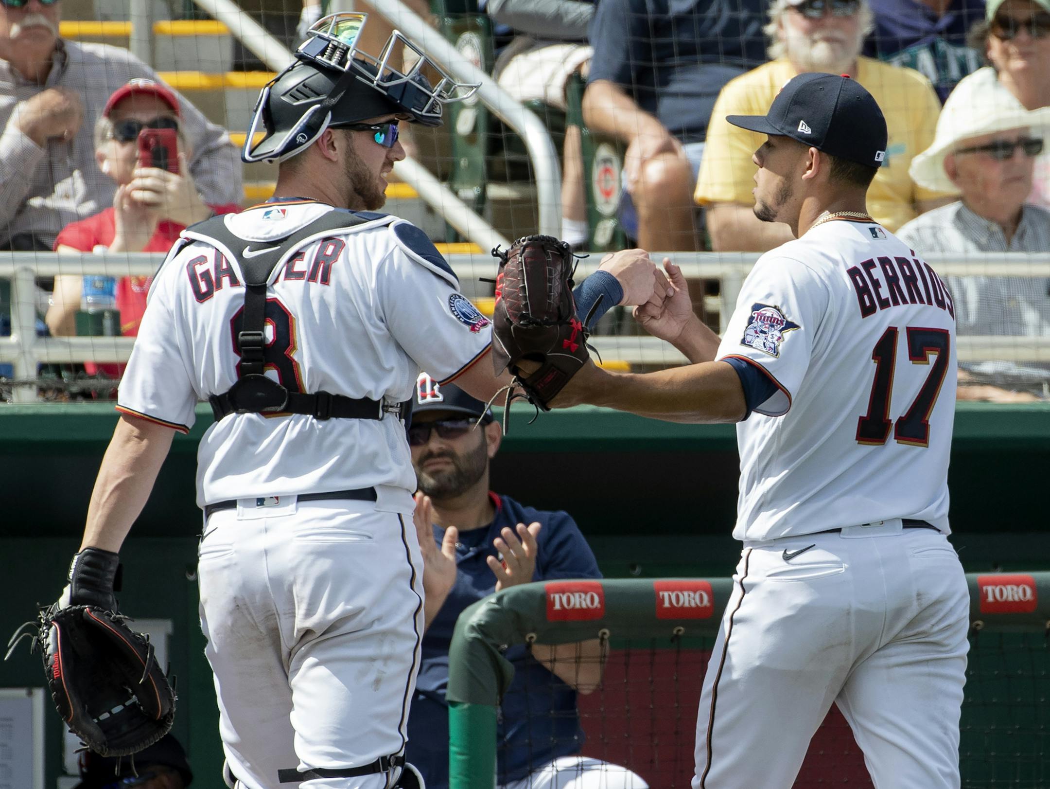 Twins catcher Mitch Garver and starter Jose Berrios compared notes at the end of the second inning against the Blue Jays on Sunday.
