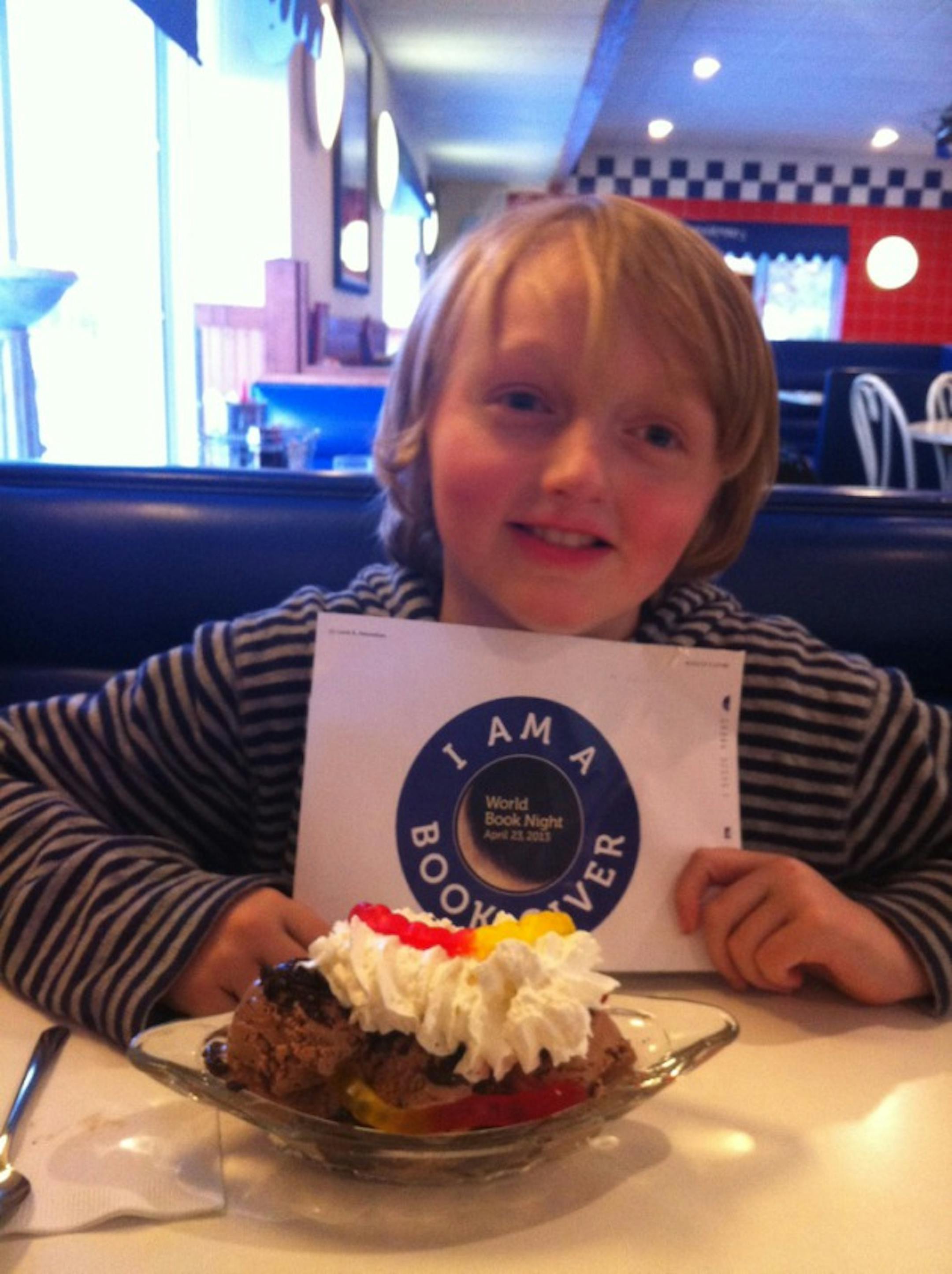 Milo Amundsen gets a sweet reward after an afternoon of giving books.