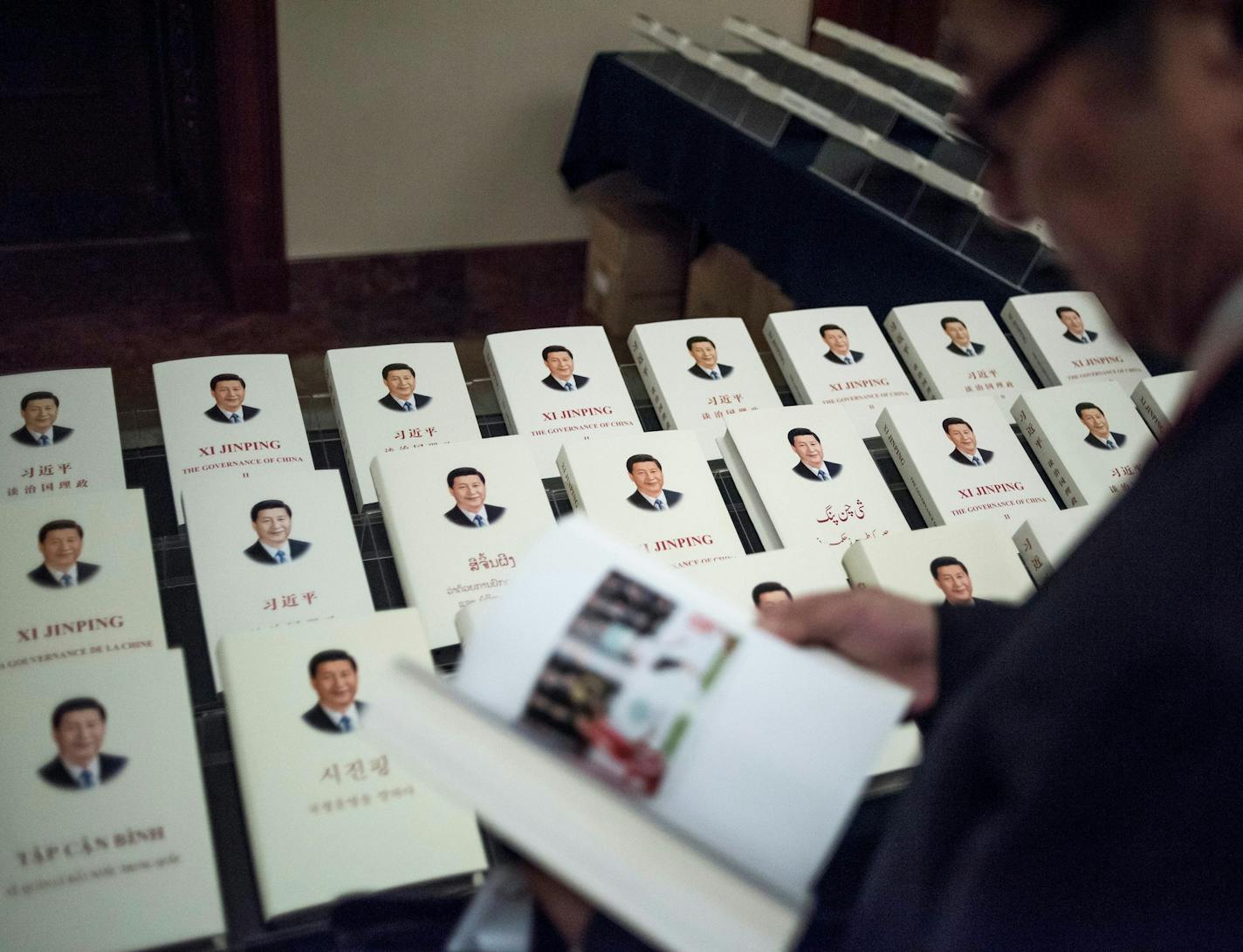 China's President Xi Jinping books, translated in foreign languages, are on display during the opening ceremony of the "CPC in dialogue with world political parties high-level meeting", at the Great Hall of the People in Beijing, Friday, Dec. 1, 2017. (Fred Dufour/Pool Photo via AP) ORG XMIT: LLT114