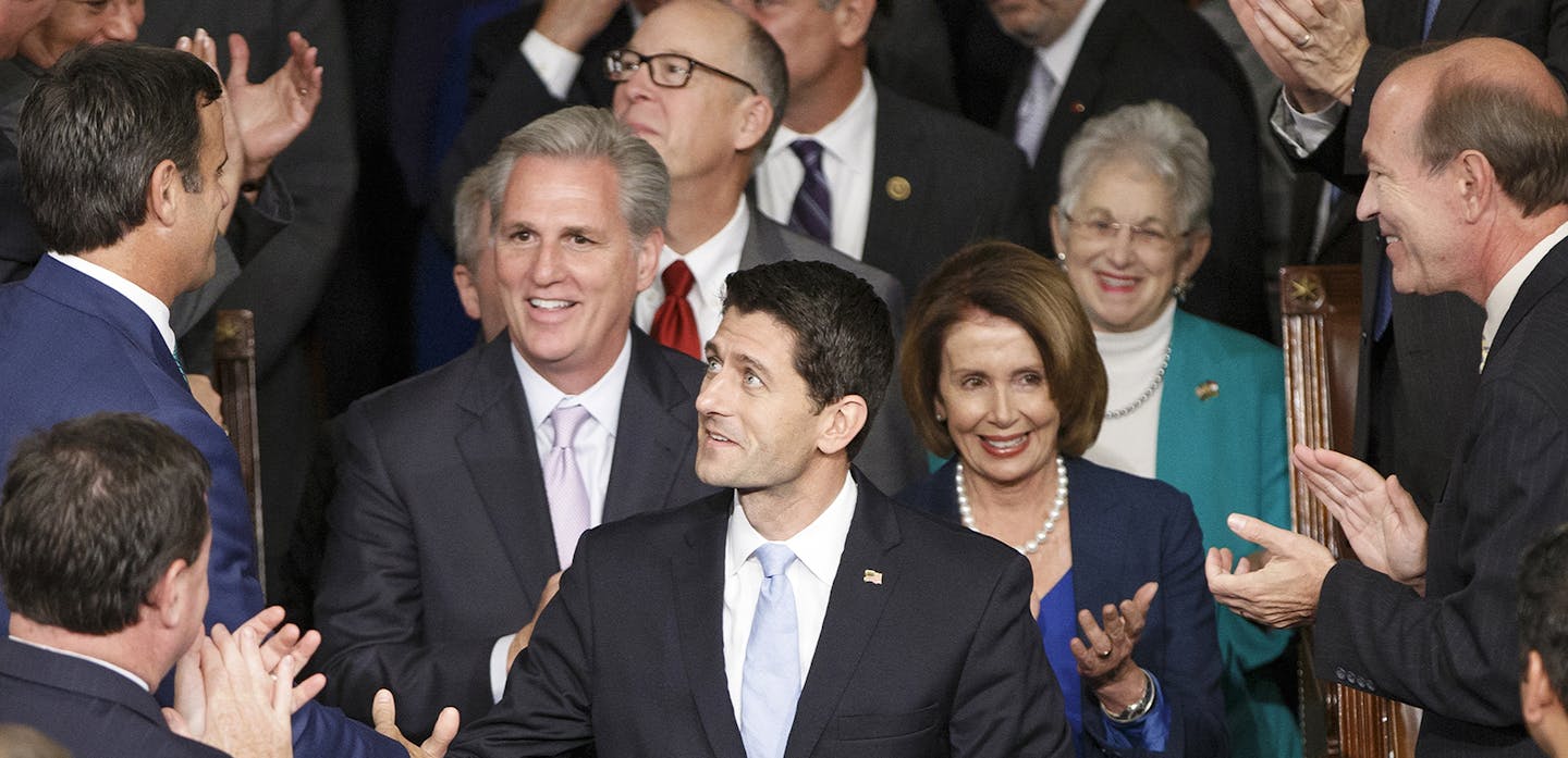 Newly-elected House Speaker Paul Ryan, R-Wisc., is escorted to the House chamber following the resignation of John Boehner, at the Capitol in Washington, Thursday, Oct. 29, 2015. Ryan is joined by Majority Leader Kevin McCarthy, R-Calif., and Minority Leader Nancy Pelosi, D-Calif. (AP Photo/J. Scott Applewhite) ORG XMIT: MIN2015110213420225